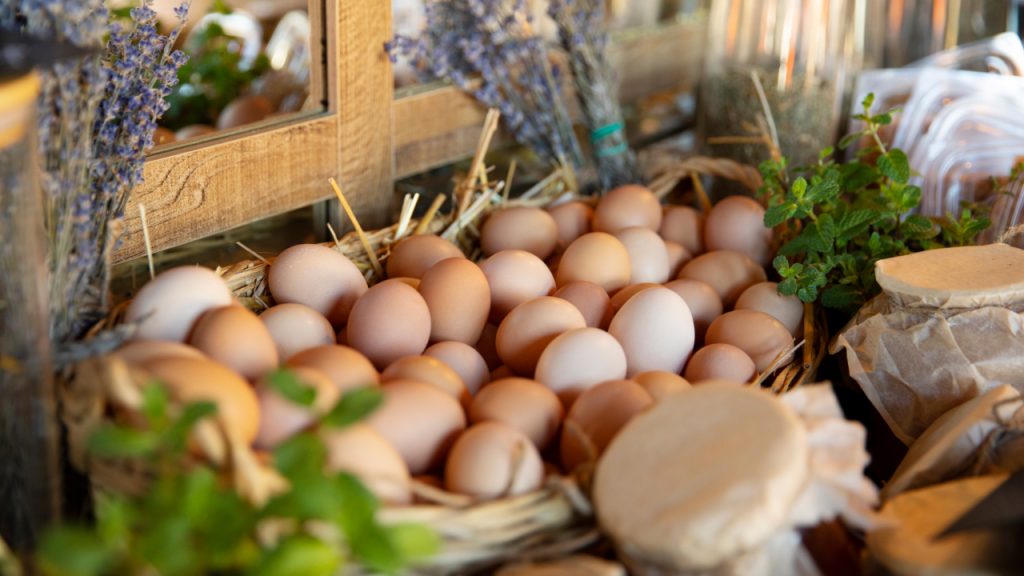 Chicken eggs in a basket with lavender