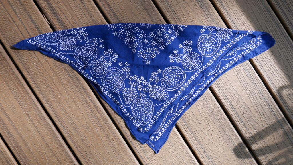 High angle view of blue bandana on wooden floor