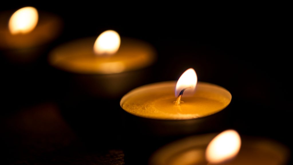 tea light Candles glowing in the dark
