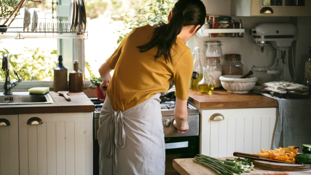 woman-cooking-in-her-kitchen-7uywJR5GMKg
